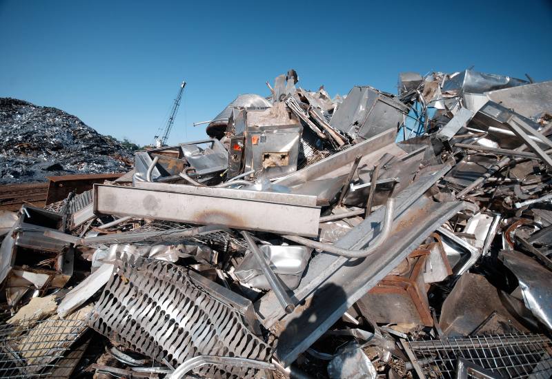 Scrap metal recycling yard in Vancouver, BC with piled cobalt